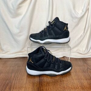 Jordan Retro 11 Black and Gold Sneakers